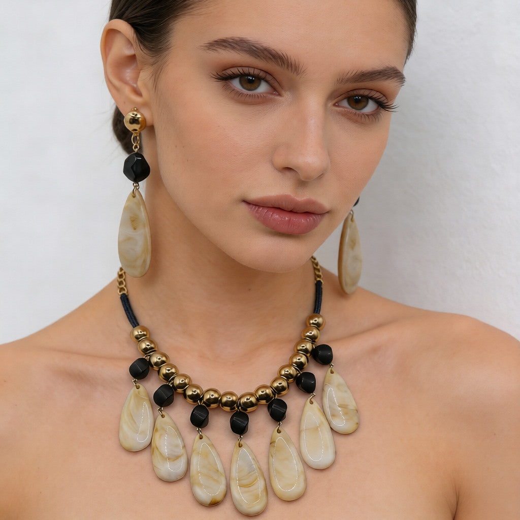 Conjunto de joyas de resina con forma de lágrima de inspiración retro: collar y pendientes llamativos