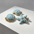 Set de 3 Pinzas para el Cabello de Estilo Marino - Concha, Estrella de Mar y Caracol, Baño de Oro y Esmalte Azul, al Por Mayor|JI JOYA