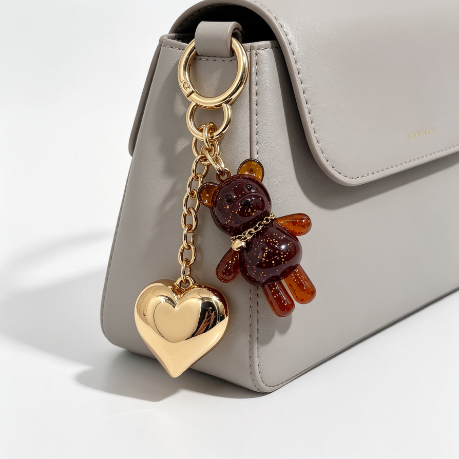 Llavero de Oso Glitter con Corazón Dorado - Accesorio de Moda para Bolsos, Venta al Por Mayor|JI JOYA