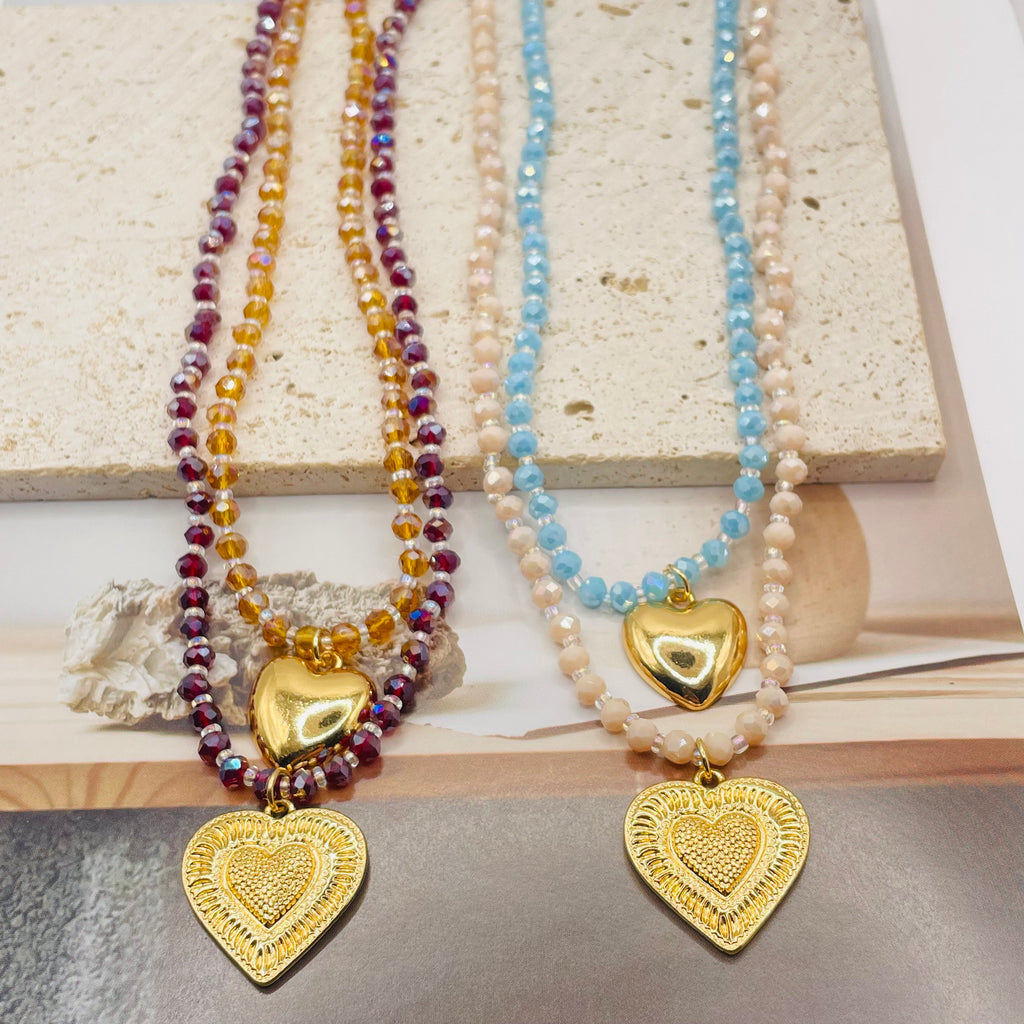 JI JOYA VENTA AL POR MAYOR|Collar Doble Capa con Colgantes Corazón Dorado | Bisutería de Moda al Por Mayor, 2 Colores Disponibles