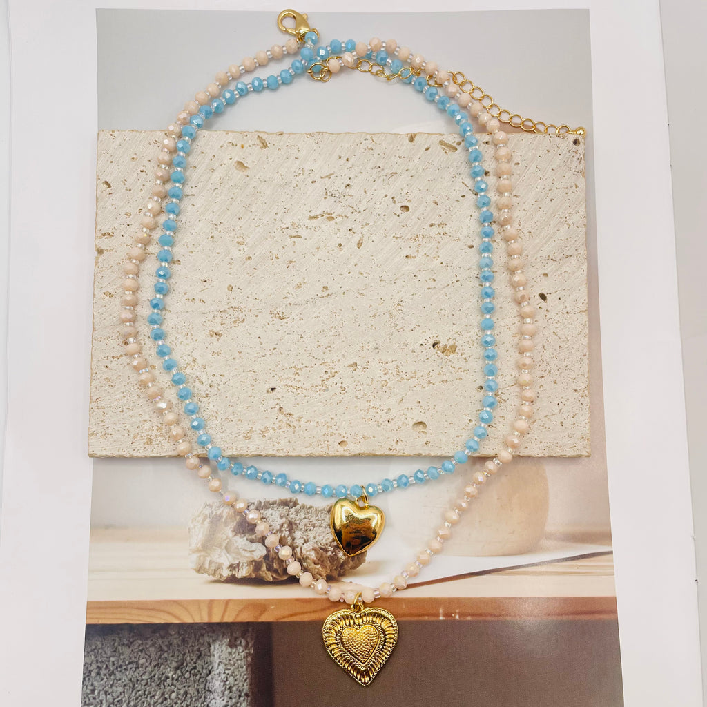 JI JOYA VENTA AL POR MAYOR|Collar Doble Capa con Colgantes Corazón Dorado | Bisutería de Moda al Por Mayor, 2 Colores Disponibles