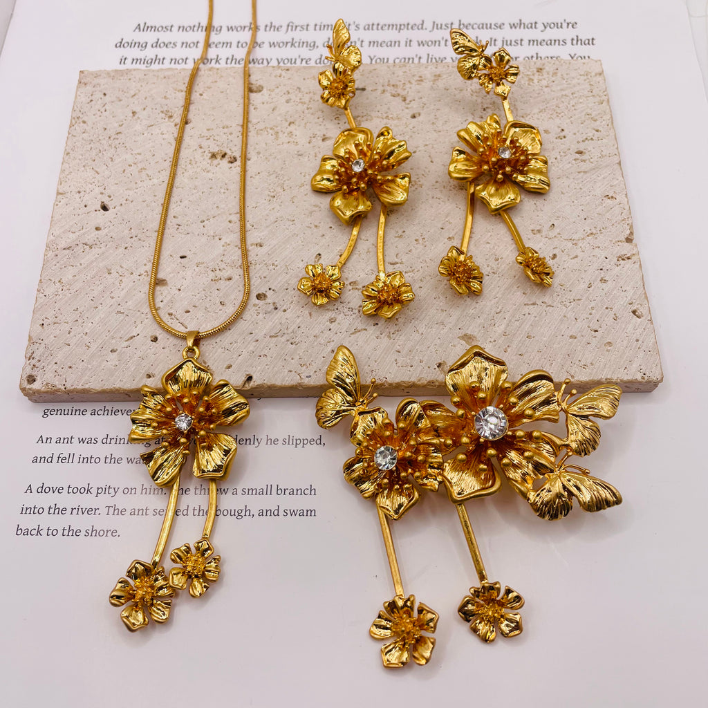 JI JOYA VENTA AL POR MAYORConjunto de Joyería de Flores Doradas con Mariposa y Circonita | Resistente al Deslustre, para Mujer, Venta al Por Mayor