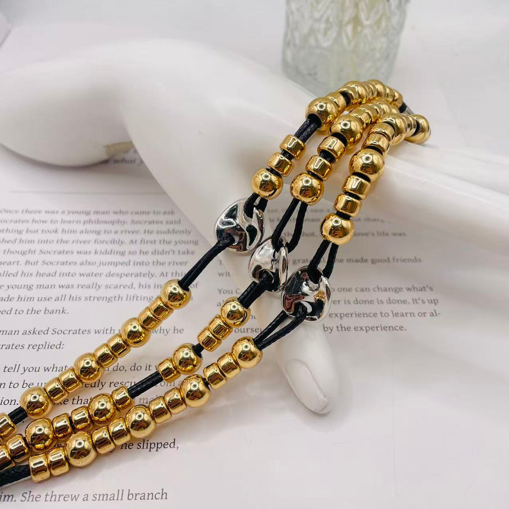 JI JOYA VENTA AL POR MAYOR|Pulsera de Moda Dorada y Plateada con Cordón Negro | Joyería al Por Mayor para Mujeres