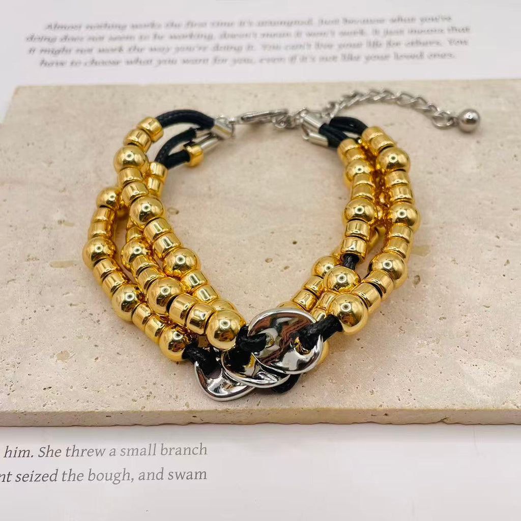JI JOYA VENTA AL POR MAYOR|Pulsera de Moda Dorada y Plateada con Cordón Negro | Joyería al Por Mayor para Mujeres