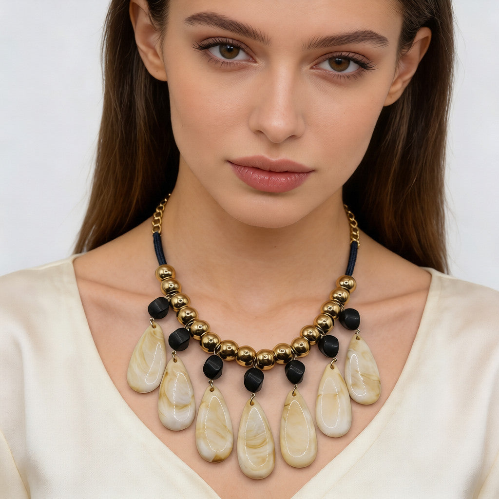 Conjunto de joyas de resina con forma de lágrima de inspiración retro: collar y pendientes llamativos
