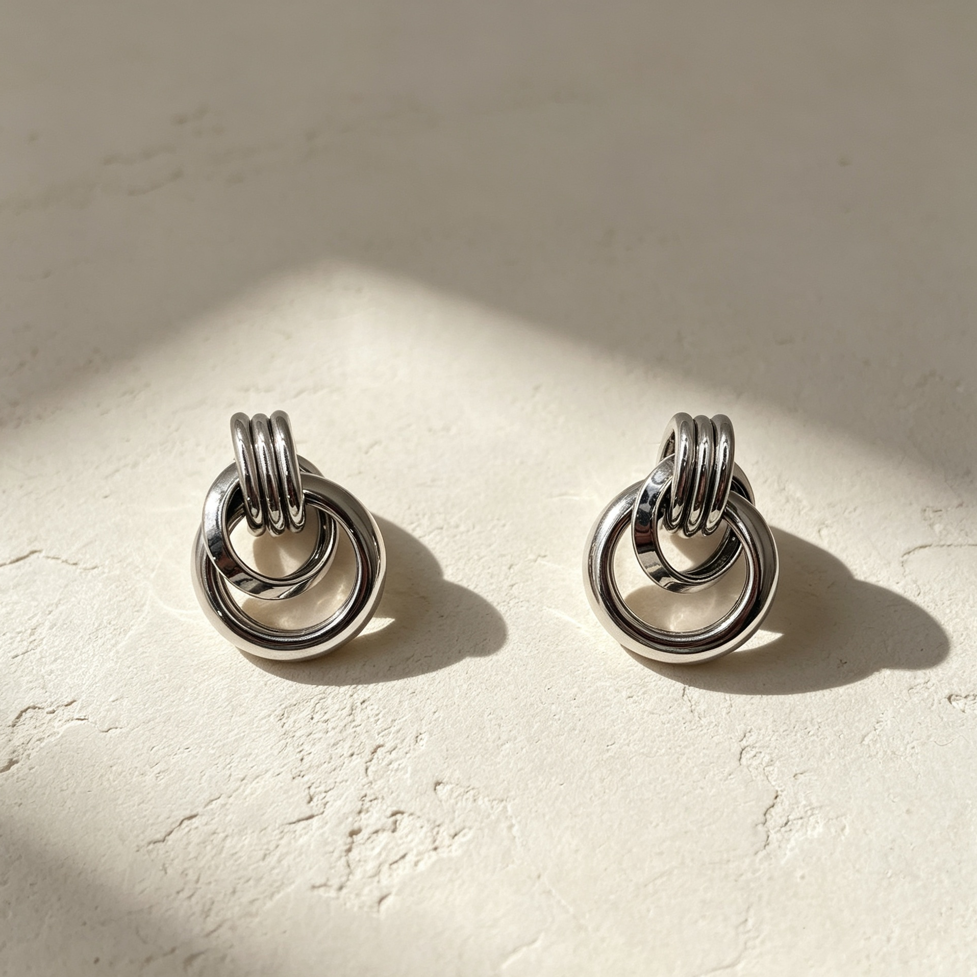 Pendientes Argolas Entrelazadas Metal Dorado & Plata | Mayorista Joyas Moda|JI JOYA