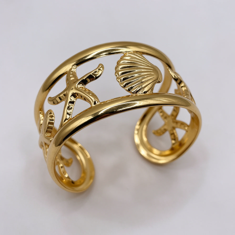 Pulsera Brazalete Abierta Dorada con Diseño de Estrella de Mar y Concha | Joyería de Playa para Mujer | Mayorista|JI JOYA