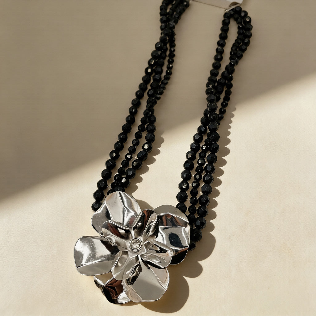 Black pearl necklace with silver floral embellishment - Luxury accessory for special occasions