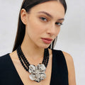 Black pearl necklace with silver floral embellishment - Luxury accessory for special occasions