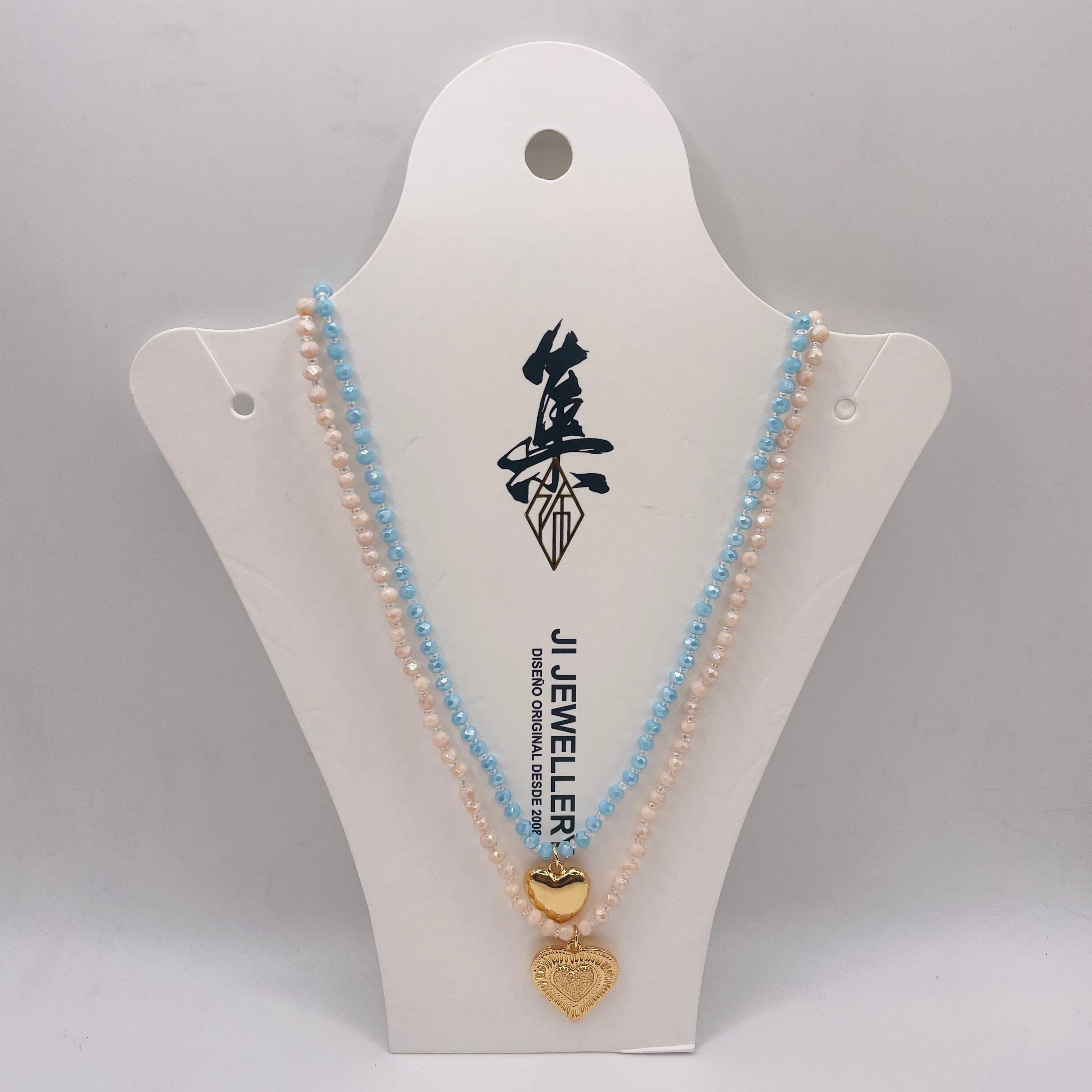 JI JOYA VENTA AL POR MAYOR|Collar Doble Capa con Colgantes Corazón Dorado | Bisutería de Moda al Por Mayor, 2 Colores Disponibles