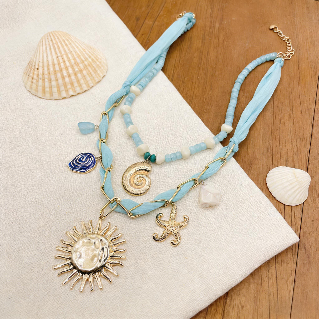 Conjunto de collar bohemio con capas de océano: collares con colgante de concha, estrella de mar y sol dorados para vacaciones de verano en la playa.